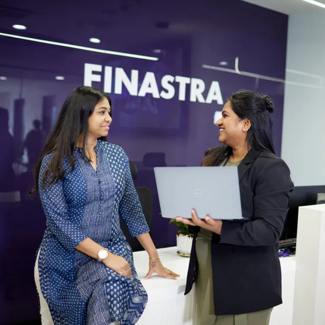 Image of two women discussing in a Finastra office