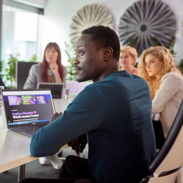 Image of team meeting in an office room