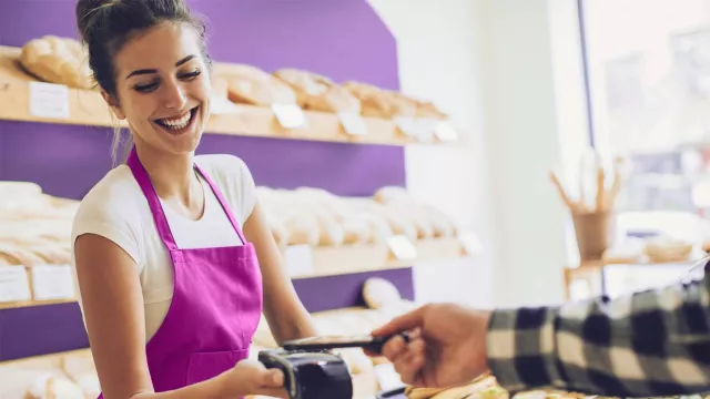 Woman taking credit card transaction