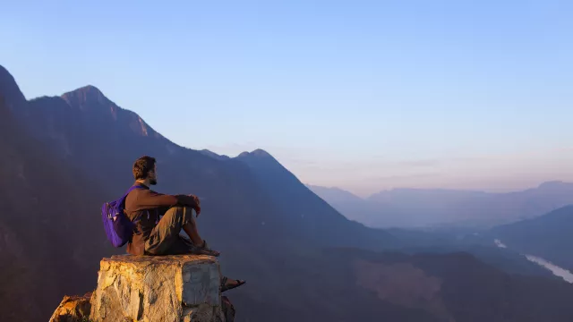 Man siting on rock