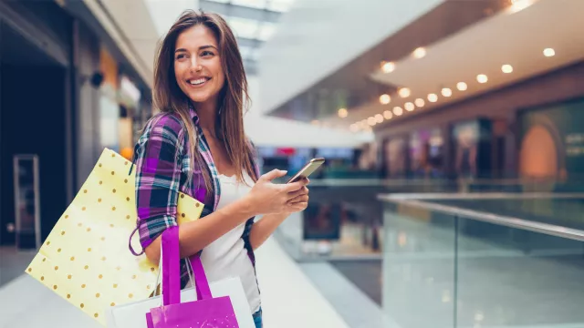 Woman with phone shopping