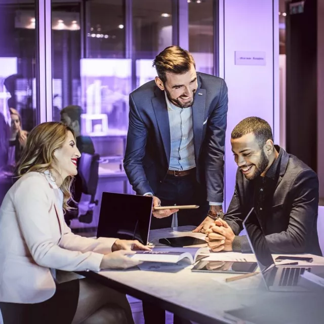 Image of team discussing in an office