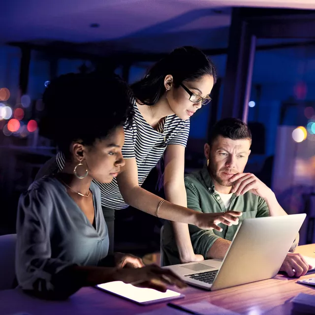 Image of team discussing in an office