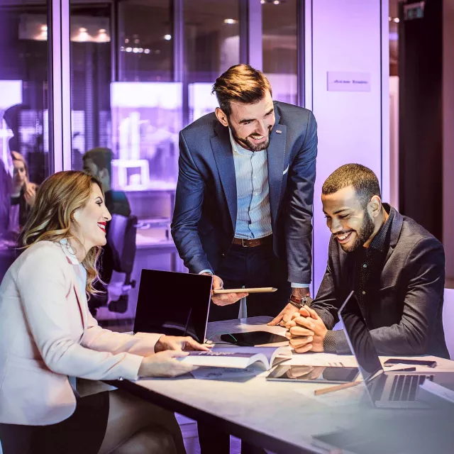 Image of team discussing in an office