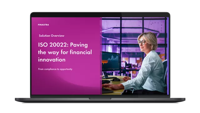 Image of laptop with cover slide for "ISO 20022: Paving the way for financial innovation" brochure