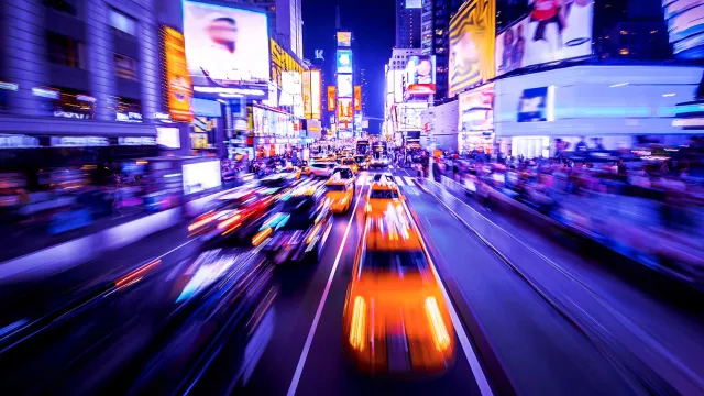 Image of city street with fast-moving vehicles