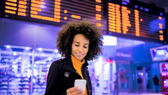 Image of a woman using her smartphone