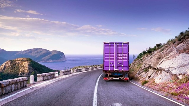 Image of cargo truck riding on the coast