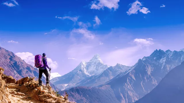 Image of a man on top of the mountains