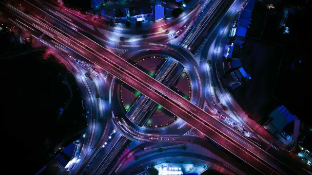 Aerial view of an illuminated roundabout at night