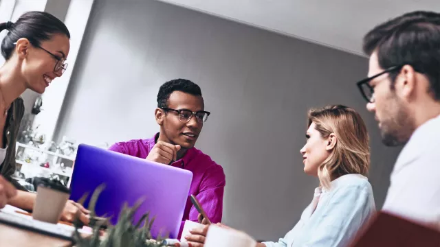 Image of 4 people at table