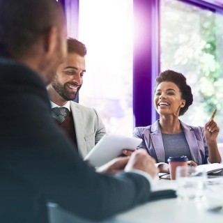 Image of team discussing in an office