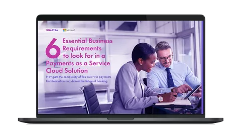 Image of laptop with cover slide of "What are the 6 essential business requirements for a Payments as a Service solution?" white paper