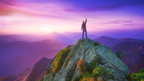 Image of man on top of a mountain