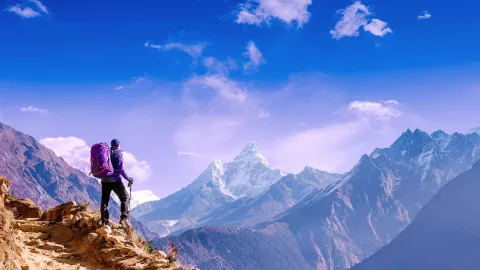 Image of a man on top of the mountains