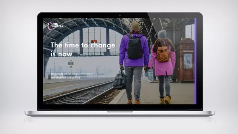 Man and woman holding hands at train station