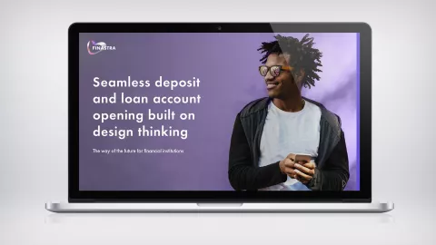 Image of laptop with man and phone